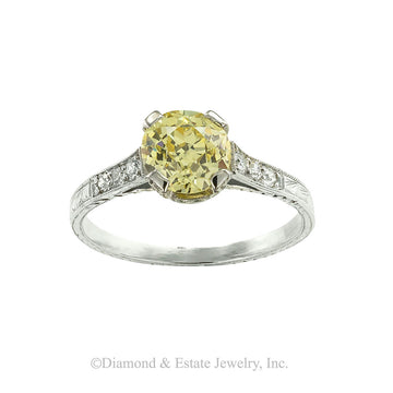 GIA report certified fancy yellow 1.20-carat old European-cut diamond and platinum solitaire engagement ring circa 1925. Jacob's Diamond & Estate Jewelry.