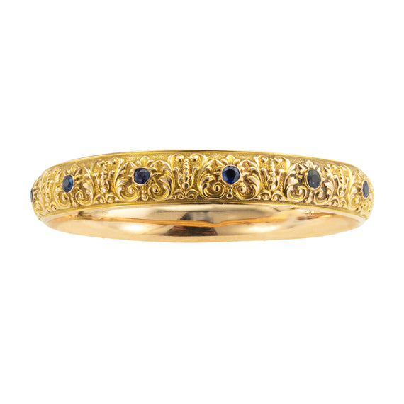 Krementz blue sapphire and gold antique slip-on bangle circa 1900.  Jacob's Diamond & Estate Jewelry.