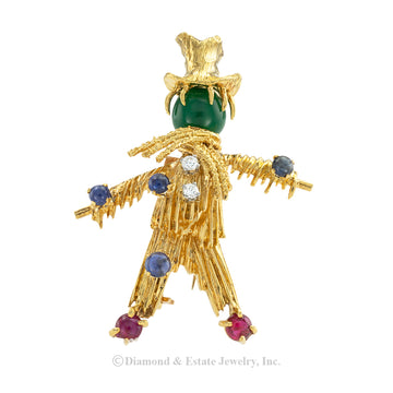 Van Cleef & Arpels gem studded yellow gold scarecrow clip brooch circa 1966. Jacob's Diamond & Estate Jewelry