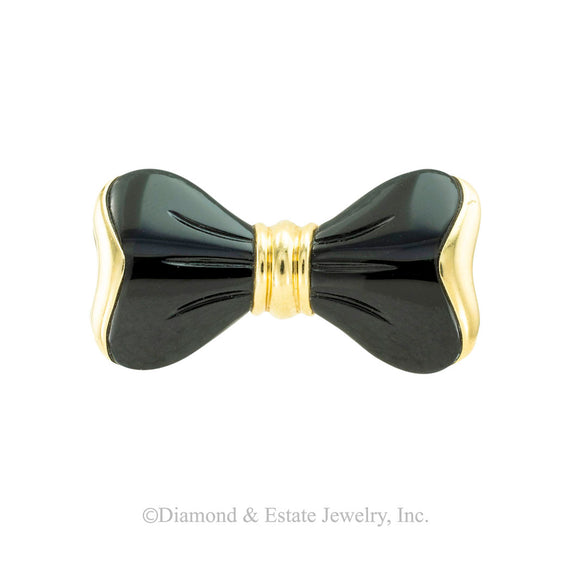 Black onyx and yellow gold bow brooch circa 1970. Jacob's Diamond & Estate Jewelry.