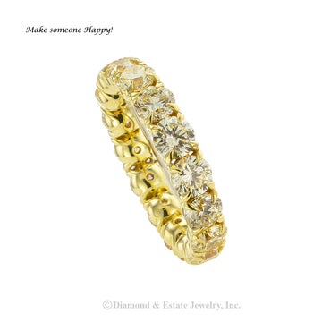 Lite yellow color diamonds and gold estate eternity ring size 8 plus.  Jacob's Diamond & Estate Jewelry.