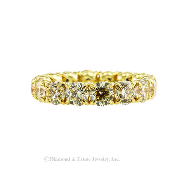 Lite yellow color diamonds and gold estate eternity ring size 8 plus.  Jacob's Diamond & Estate Jewelry.